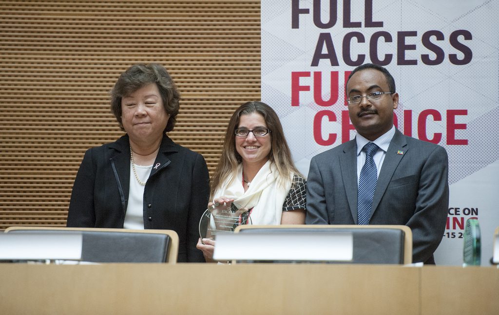 Caroline received the EXCELL award from Professor Amy Tsui, Director of the Bill & Melinda Gates Institute for Population and Reproductive Health, and His Excellency Dr. Kesete-Birhan Admasu, Minister of Health of the Federal Democratic Republic of Ethiopia (photo credit: David Colwell)