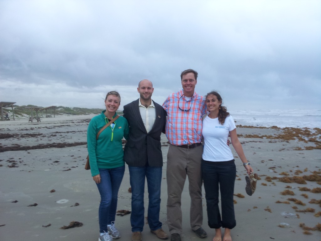 (L-R) Dr. Stephanie Green (Oregon State University), Alexander Bogdanoff (NOAA), Dr. James Morris Jr. (NOAA) and Jennifer Chapman (Blue Ventures) on the windy beach at Padre Island, TX, USA.