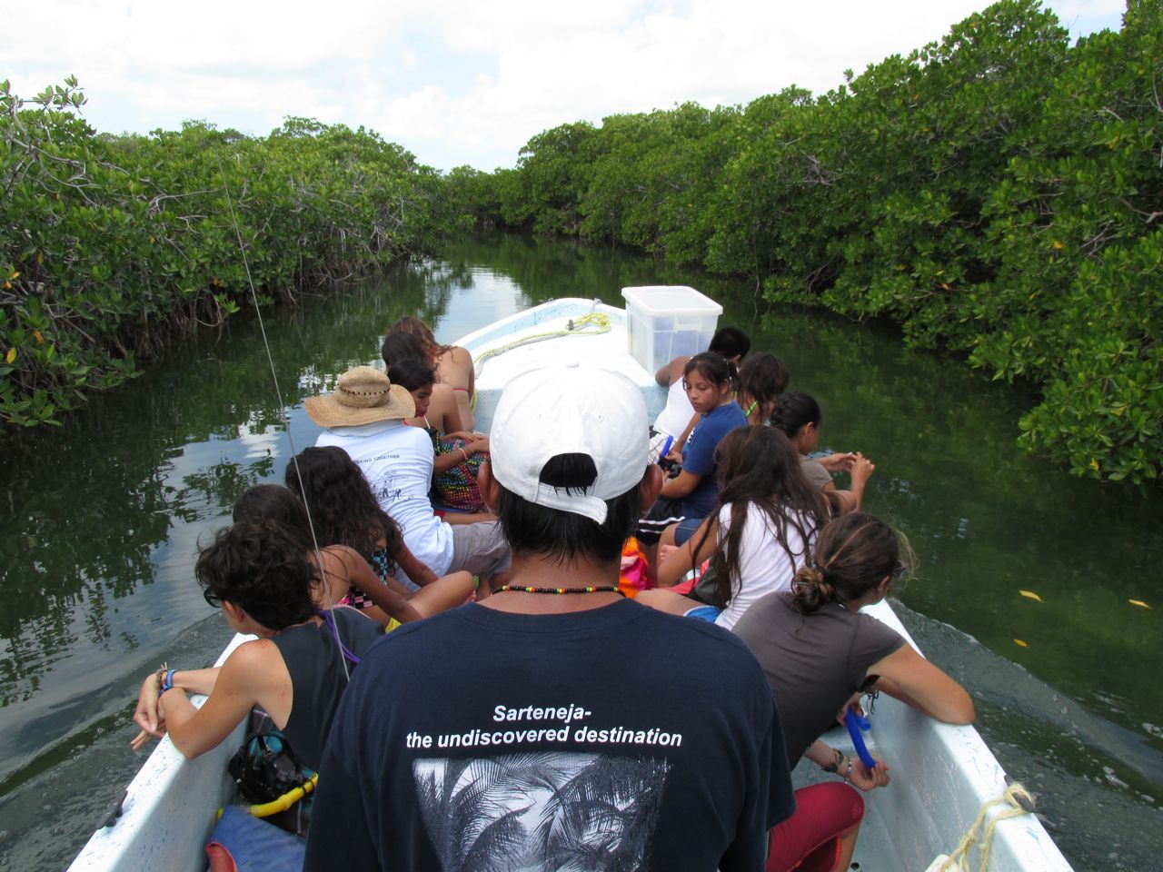 As we slowly motor down the old Mayan channel cut through the mangroves, students spot rays and fish