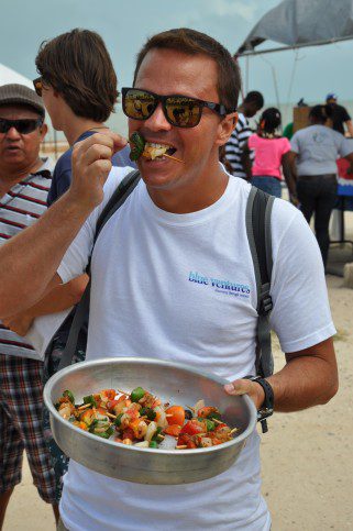 Marcos, one of our fantastic volunteers from Brazil! Taking a moment at the Reef Fair to try the delicious lionfish kebabs that were given out to visitors. Many of whom tried lionfish for the very first time! Prepared by our masterchef Victor Santoya 