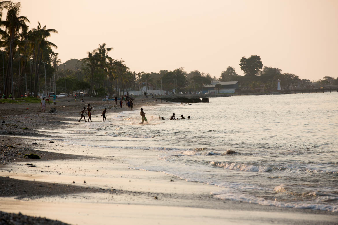 As the sun sets along the beach front in Dili people gather to swim and fish. Photo | Martin Muir