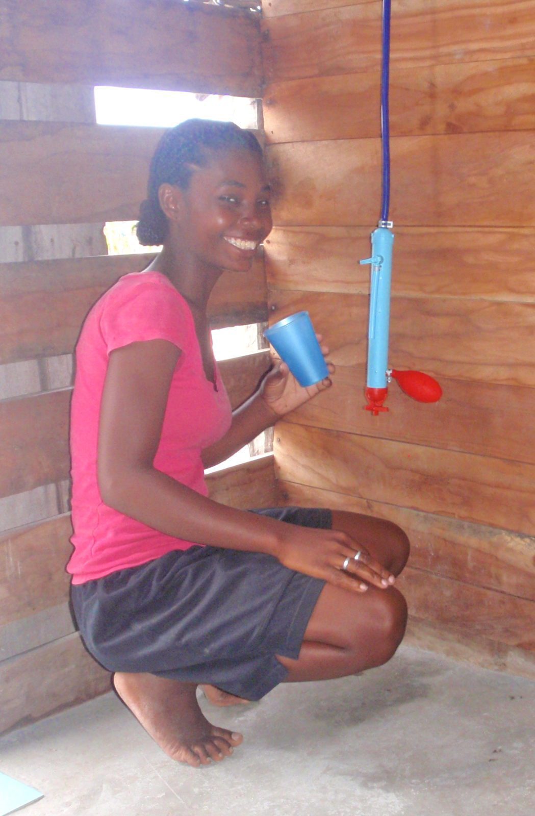 Voahirana enjoys drinking water filtered through a Family LifeStraw because it tastes really pure and she knows that it is clean