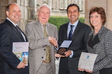 Vik shaking hands with Sir Crispen Tickell, with David Chenier (President, UK, ConocoPhillips) and Professor Louise Richardson (Principal and Vice-Chancellor, University of St Andrews)