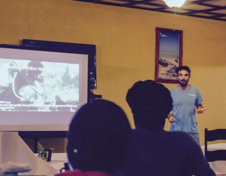 Davide presenting Blue Ventures' strategy to the Caribbean Youth Environmental Network in Sarteneja.