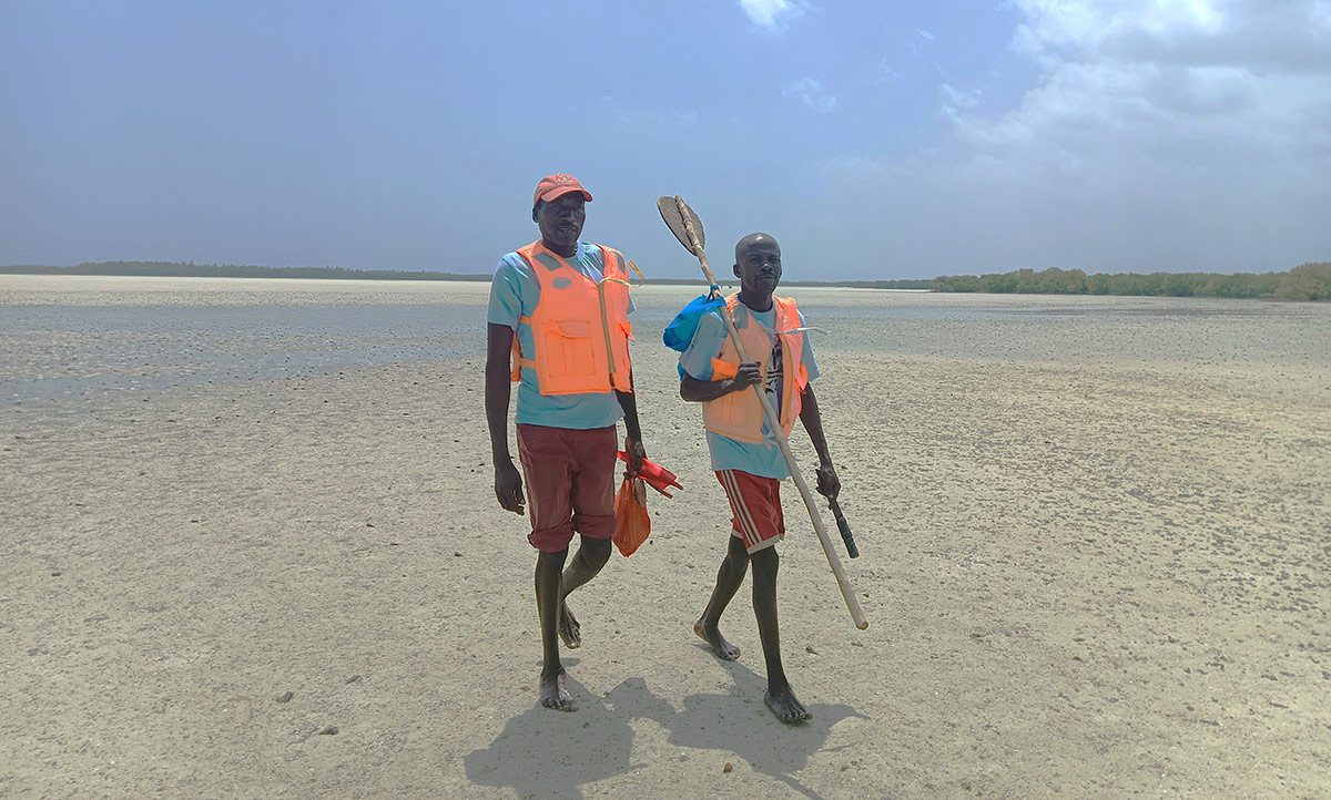 Two fishermen returning